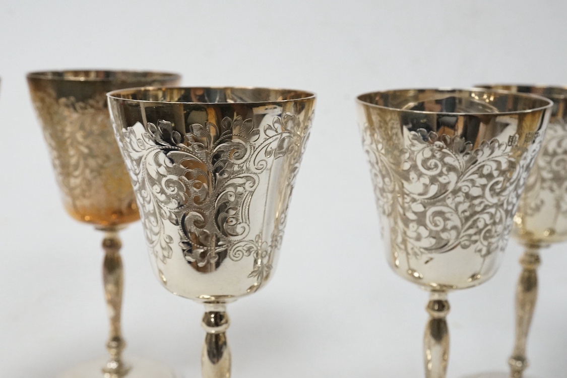 A set of six Elizabeth II engraved silver small goblets, by Charles S. Green & Co, Birmingham, 1973, height 11.6cm, 15.9oz. Condition - poor to fair to good